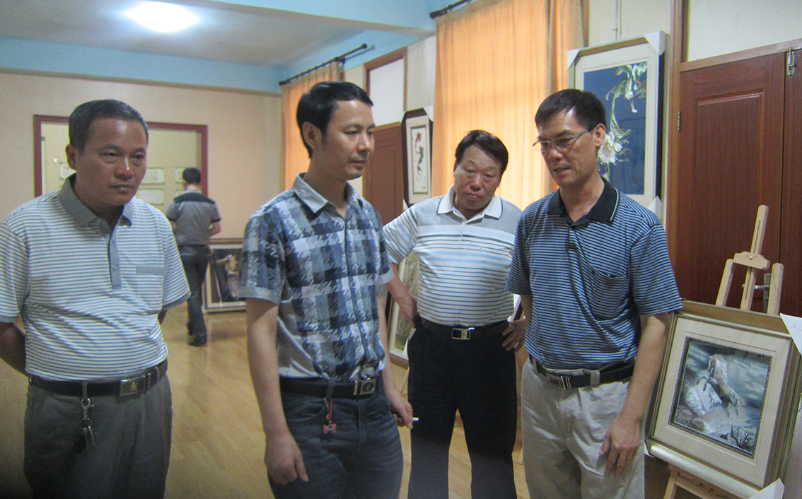 蔡民强与朱军成共商刺绣合作大计